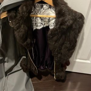 Brown real rabbit fur vest with cinched waist with sweater material.